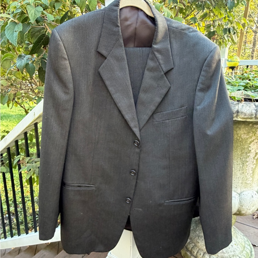 Charcoal grey men’s suit jacket and pants